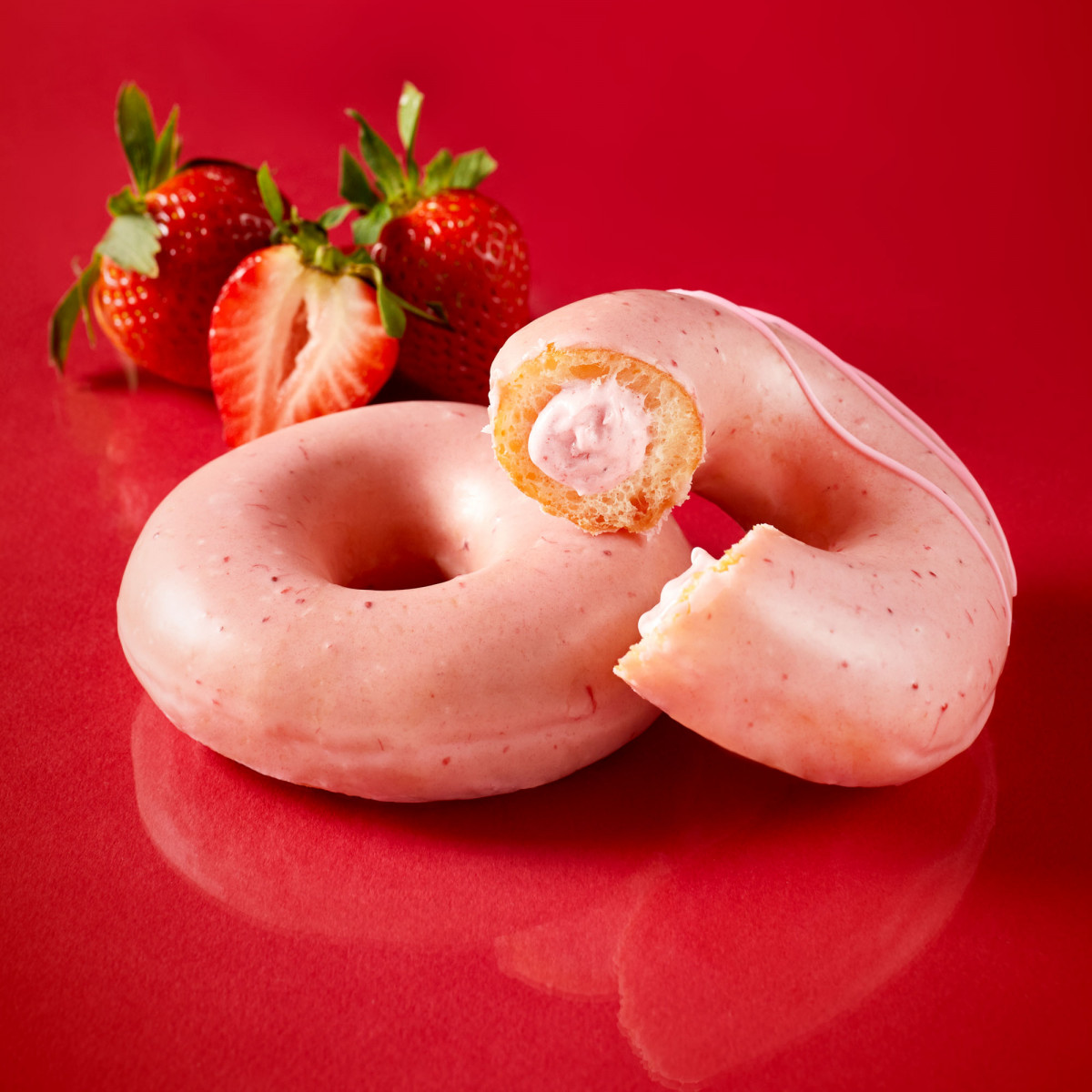 Food product photo of pink strawberry glazed doughnuts from Krispy Kreme