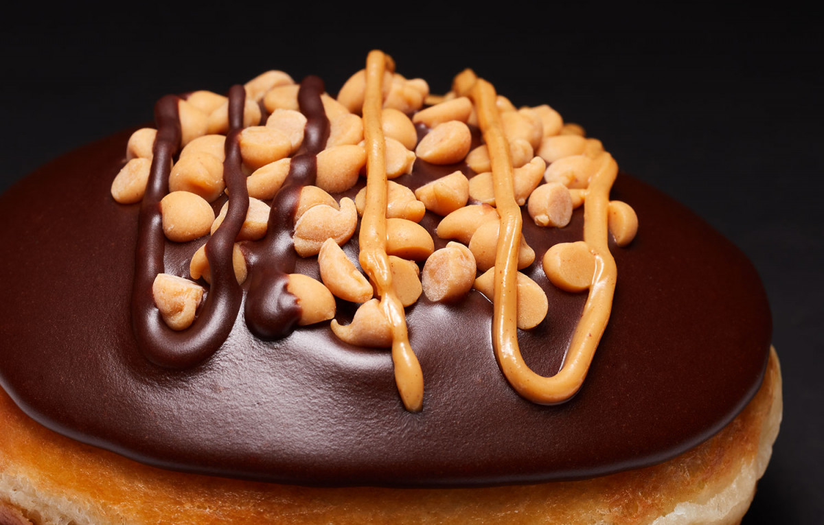 Close up product photo of a Krispy Kreme Reese's doughnut